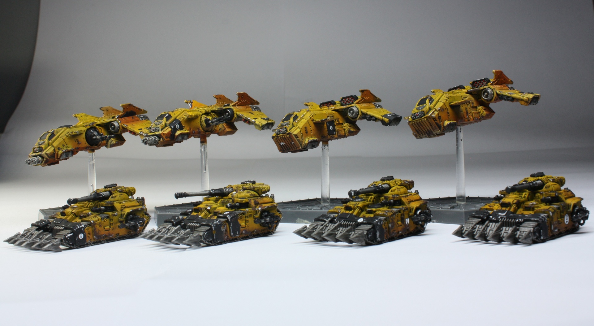 Imperial Fists Aeronautica flyers and tanks in yellow heresy-era livery