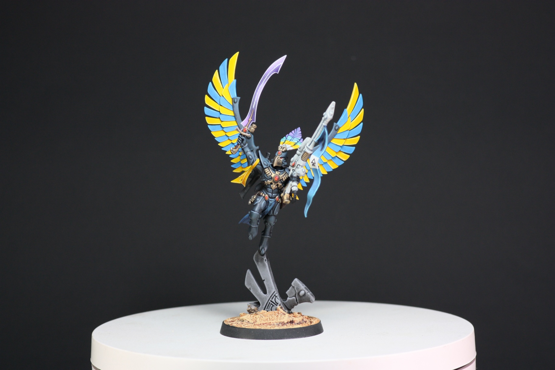 Aeldari Phoenix Lord Baharroth in flight with yellow and blue feathered wings