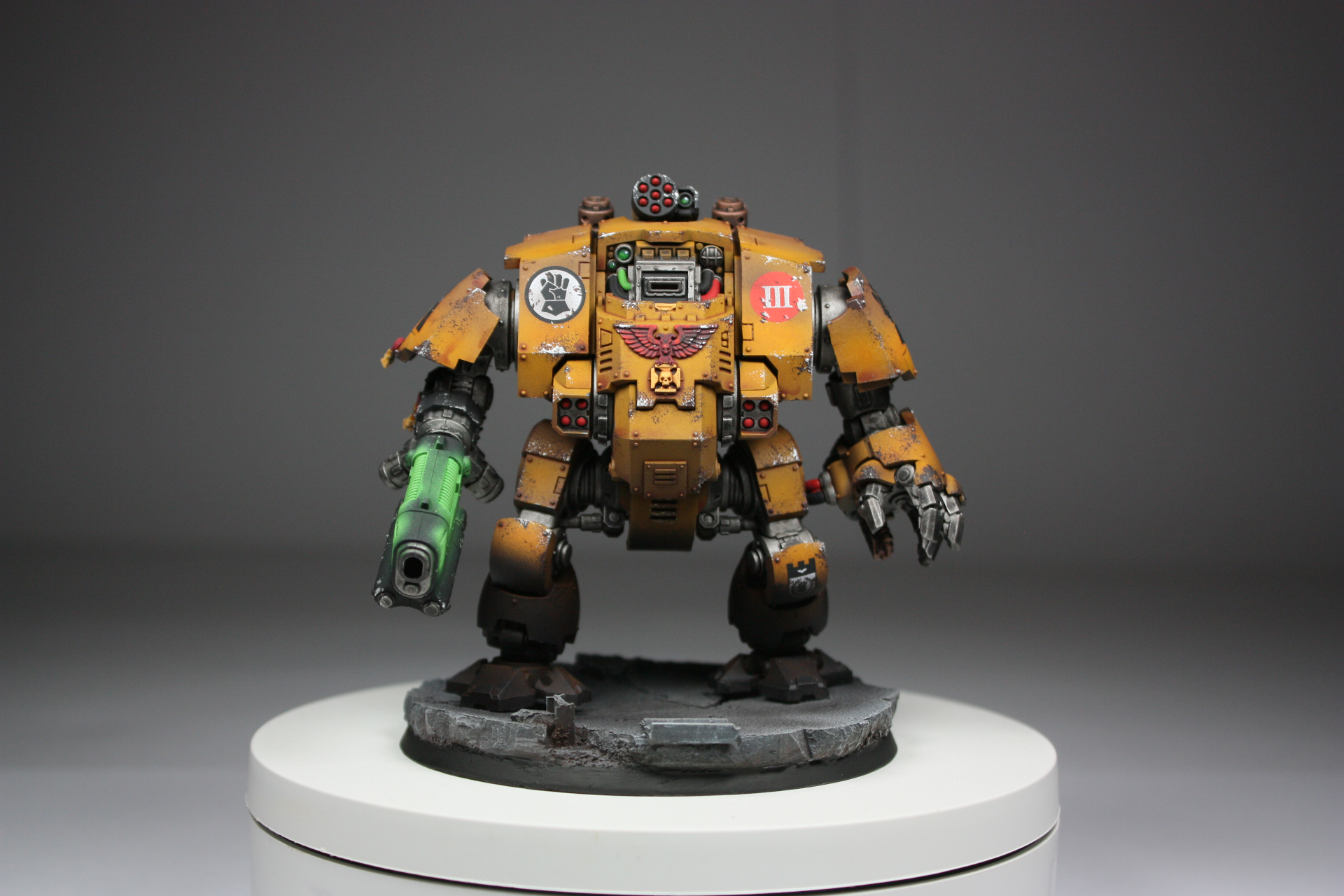 Imperial Fists Redemptor Dreadnought in yellow with battle damage and plasma cannon