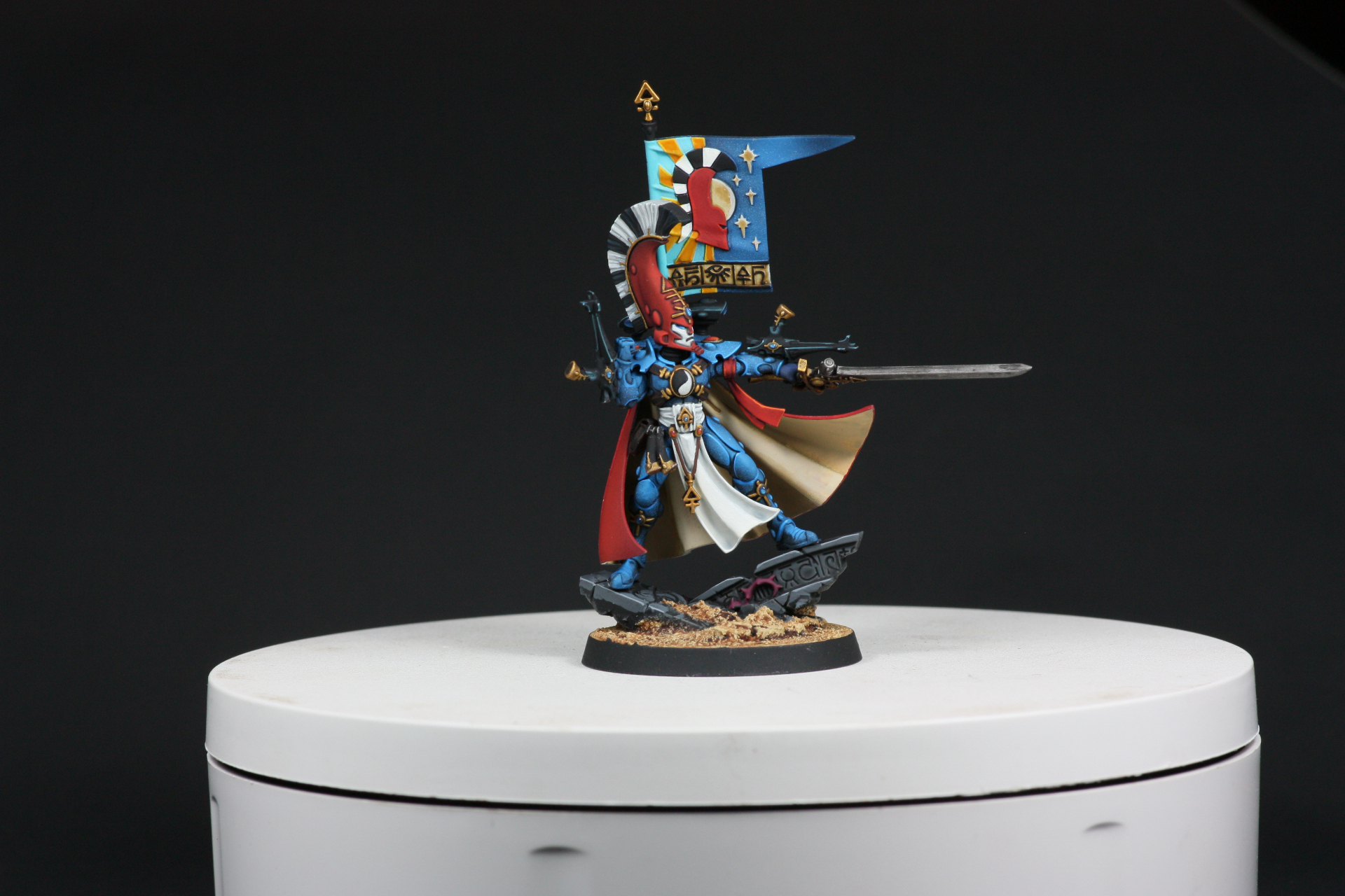 Asurmen Phoenix Lord display on plinth with banner and drawn sword