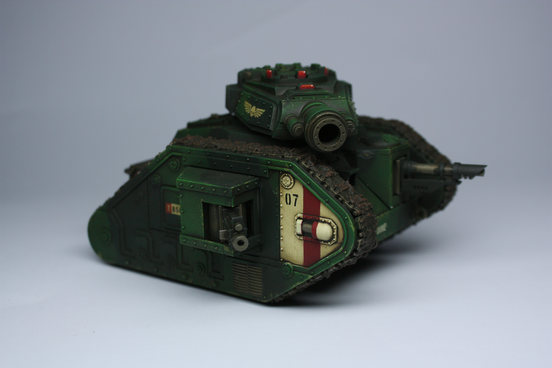Astra Militarum Leman Russ battle tank in weathered green with red hazard stripe