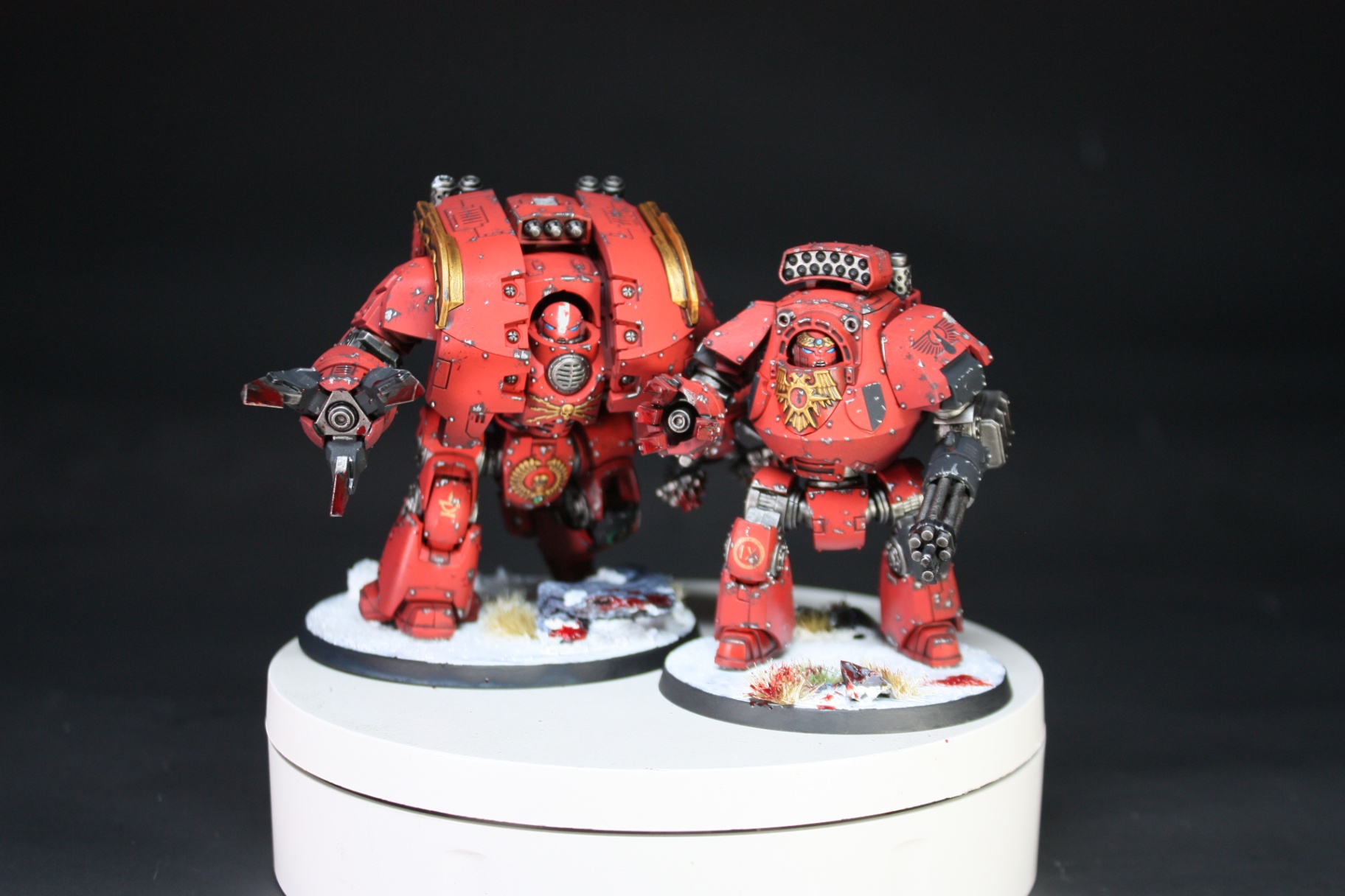 Blood Angels Leviathan and Contemptor Dreadnoughts in red and gold on snowy bases