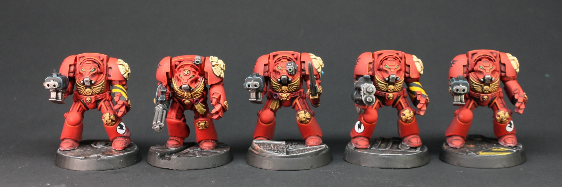 Five classic Blood Angels Terminators in red armour with storm bolters