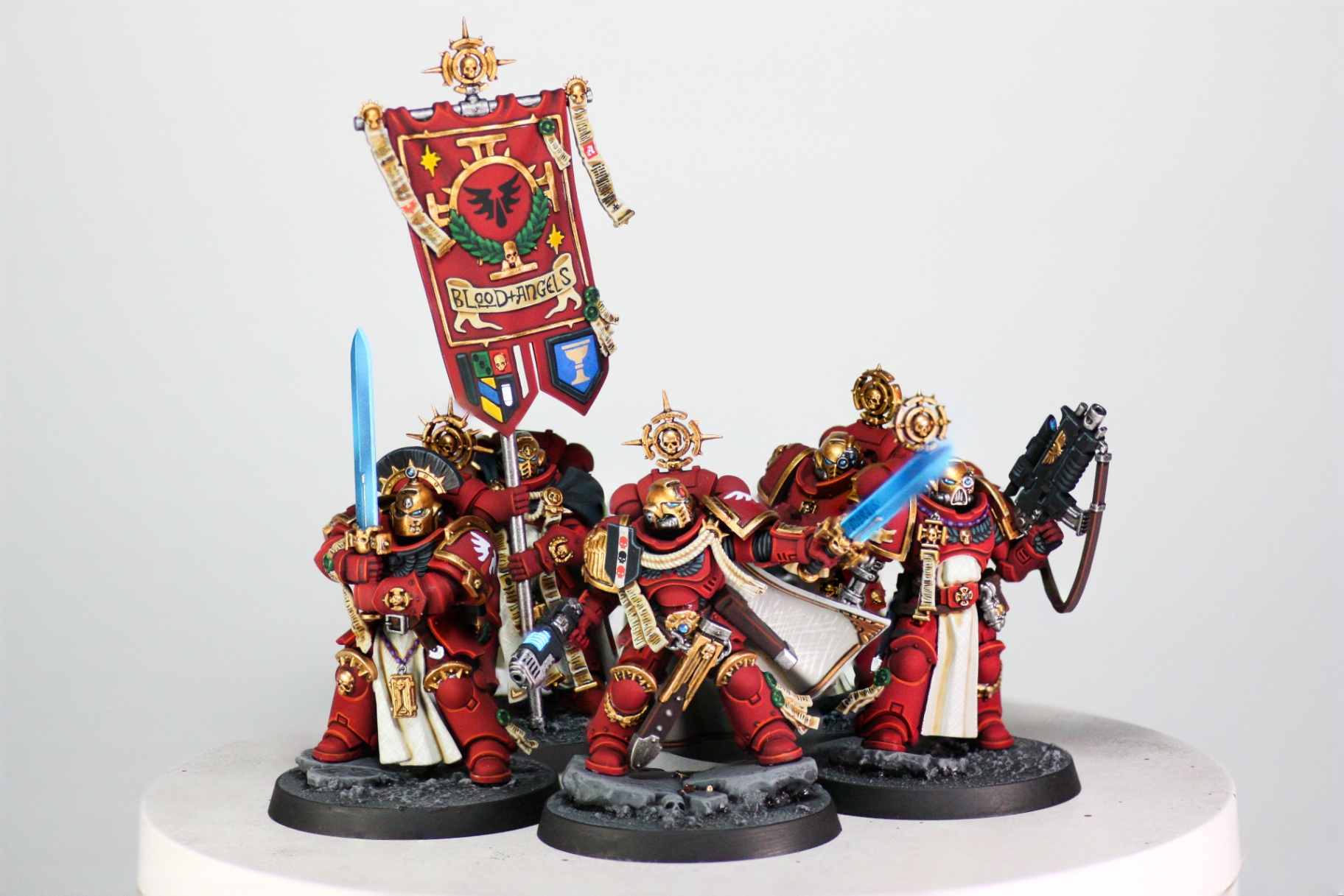 Blood Angels command squad beneath chapter banner